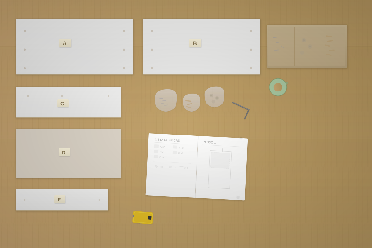 Peças de mobiliário flat-pack organizadas no chão com instruções abertas